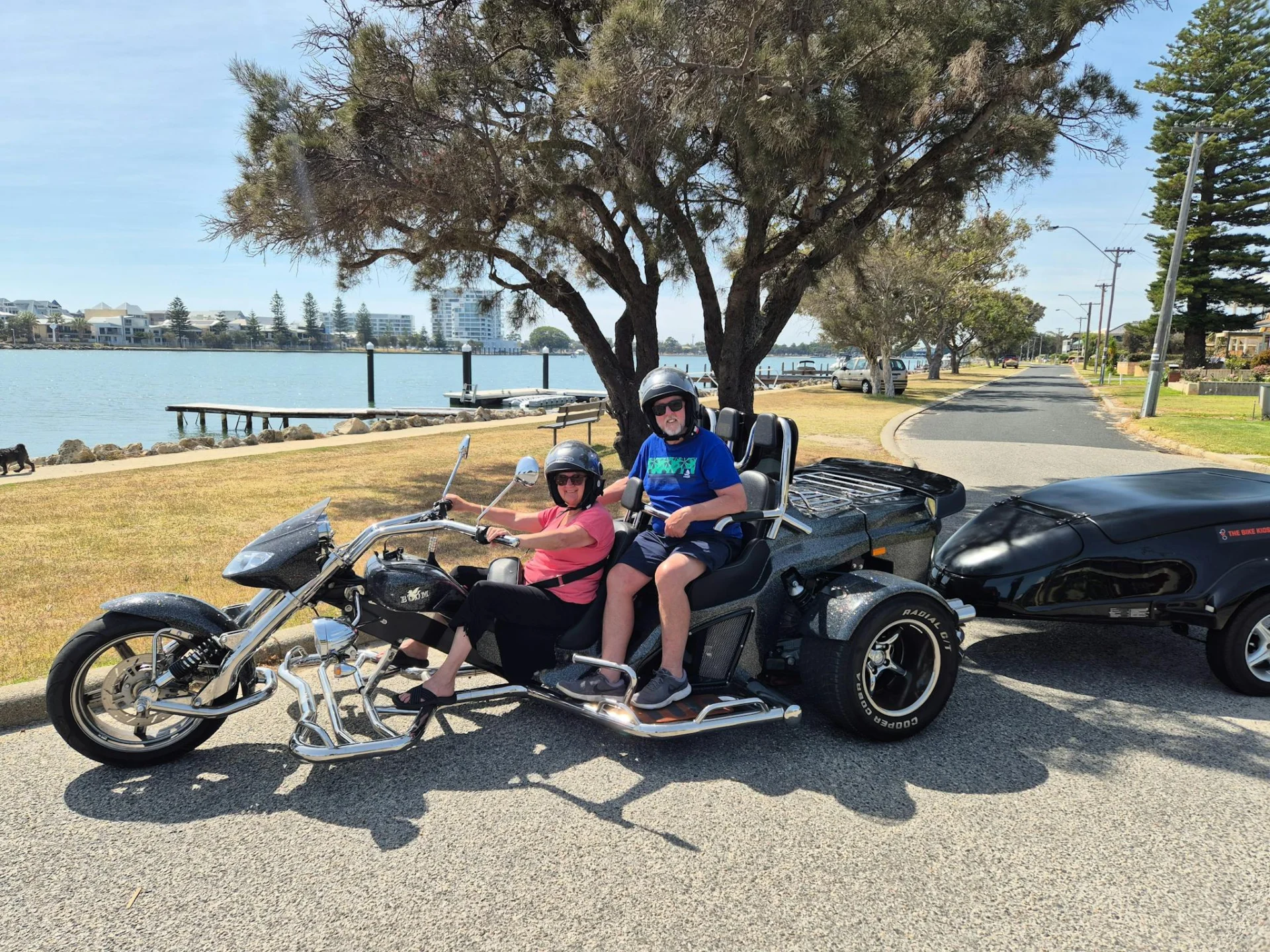Picture is to be sent to their children they have just  bought a Trike