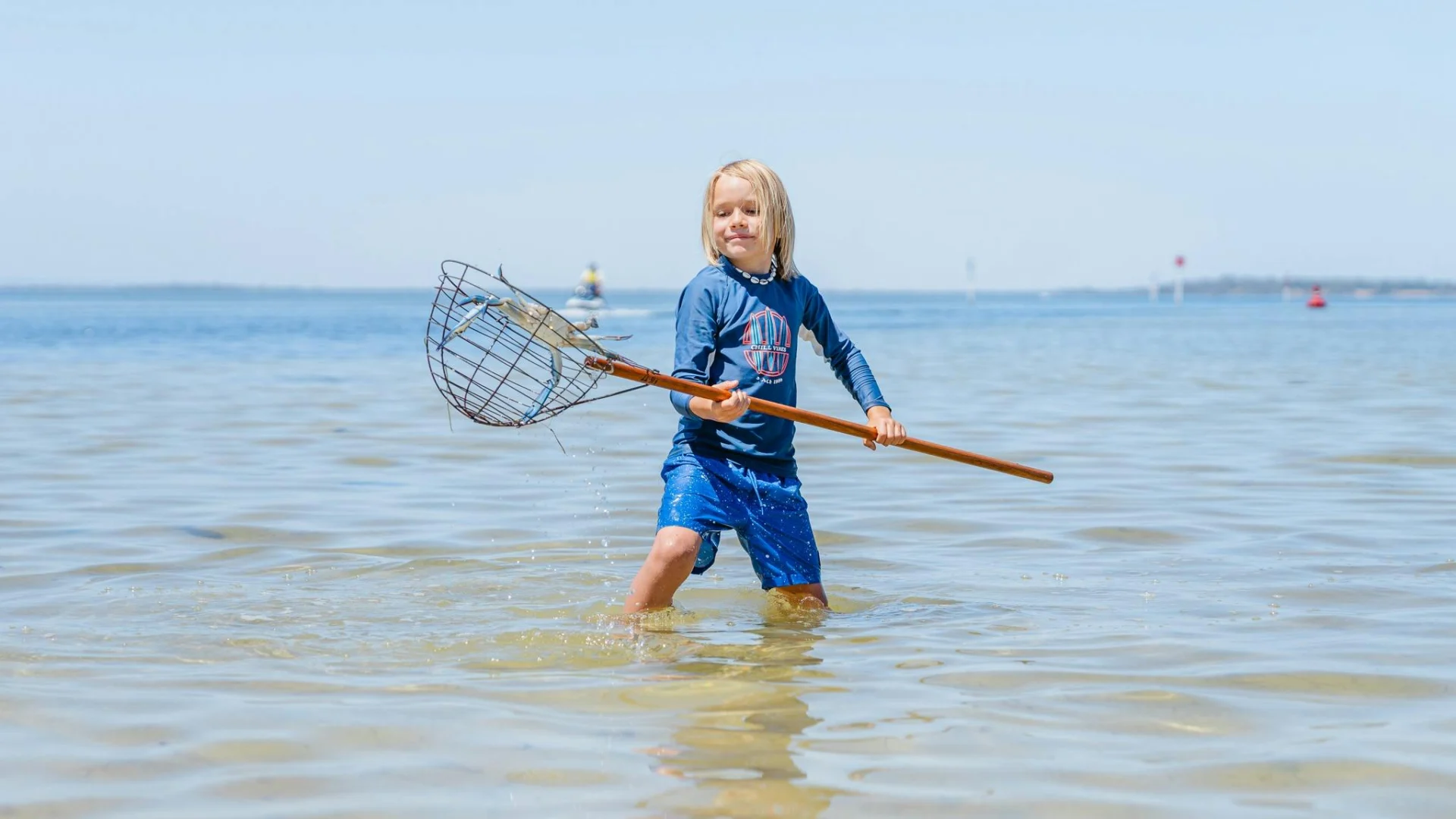Young boy crabbing at Novara Foreshore Reserve