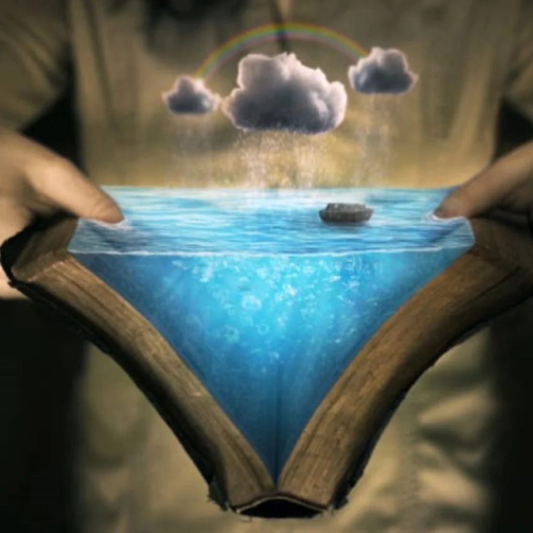 A person holds open a book with water flowing out, forming a small ocean with a boat, clouds, rain, and a rainbow above, blending reality and fantasy.