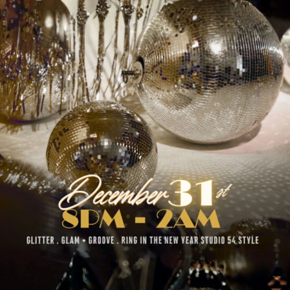 Disco balls and gold decorations with text: December 31st, 8PM - 2AM. Glitter. Glam. Groove. Ring in the New Year Studio 54 style. Festive party atmosphere with reflective ornaments.