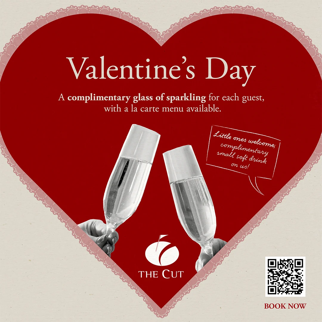 A heart-shaped Valentine’s Day ad featuring two hands clinking champagne glasses. Text offers a complimentary glass of sparkling wine per guest at The Cut restaurant, with a QR code and “Book Now” message.