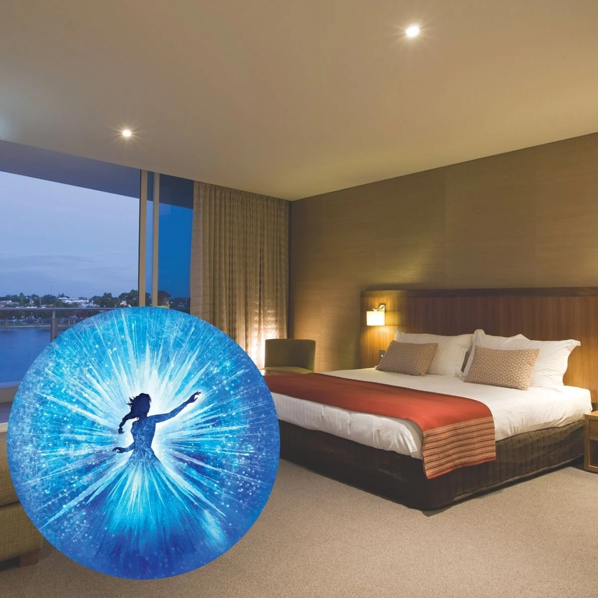 A hotel room with a large bed and window, featuring an overlay of a glowing silhouette of the FROZEN charcter Elsa in a blue, sparkling, magical dress with an outstretched arm.
