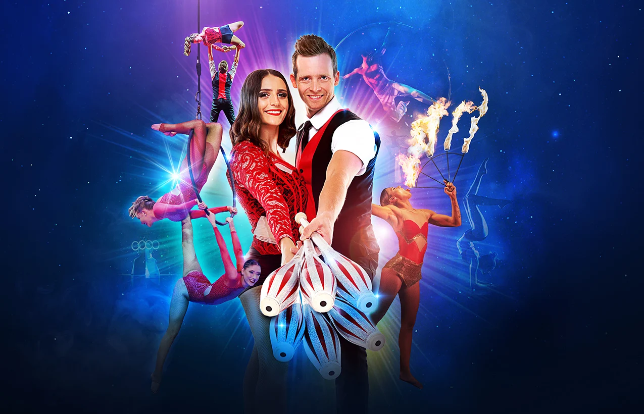 A vibrant circus poster featuring a juggler couple in the foreground holding juggling pins, surrounded by aerial performers and a fire breather in the background.