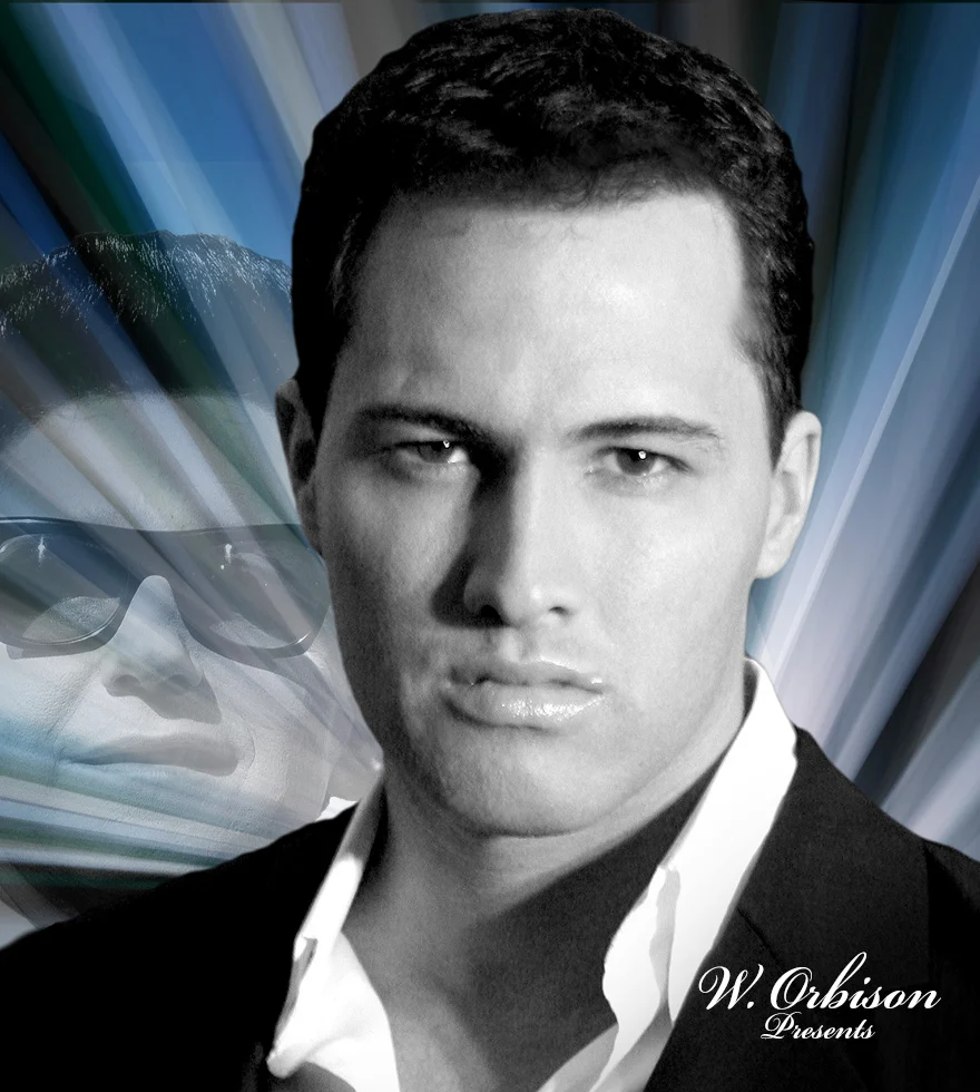 A man with dark hair in a black suit and white shirt poses in front of a background featuring a stylized image of another man wearing dark sunglasses. The text W. Orbison Presents appears in the bottom right corner.