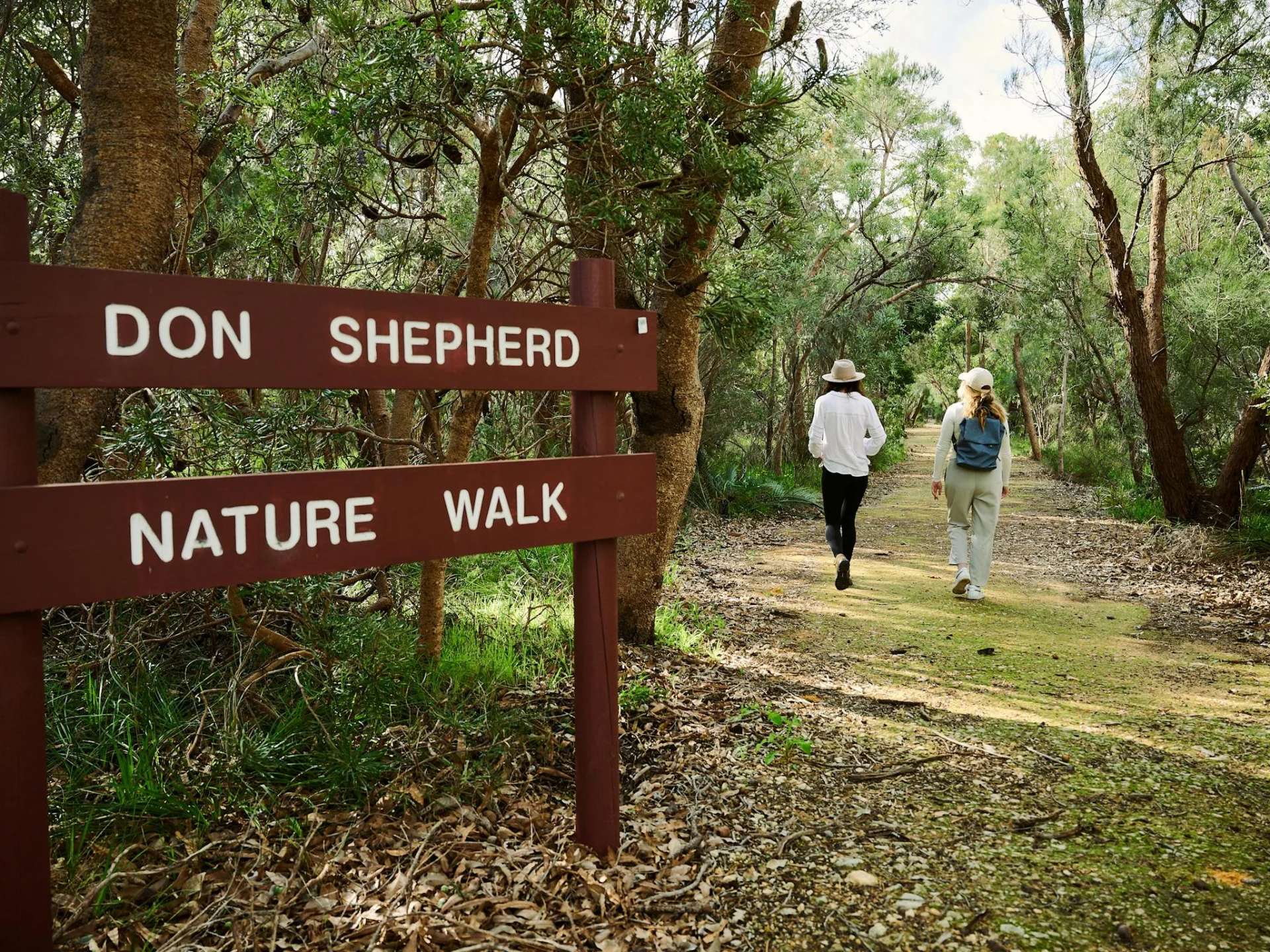 Two women walking the Nyoongar & Don Shepherd Nature Trail