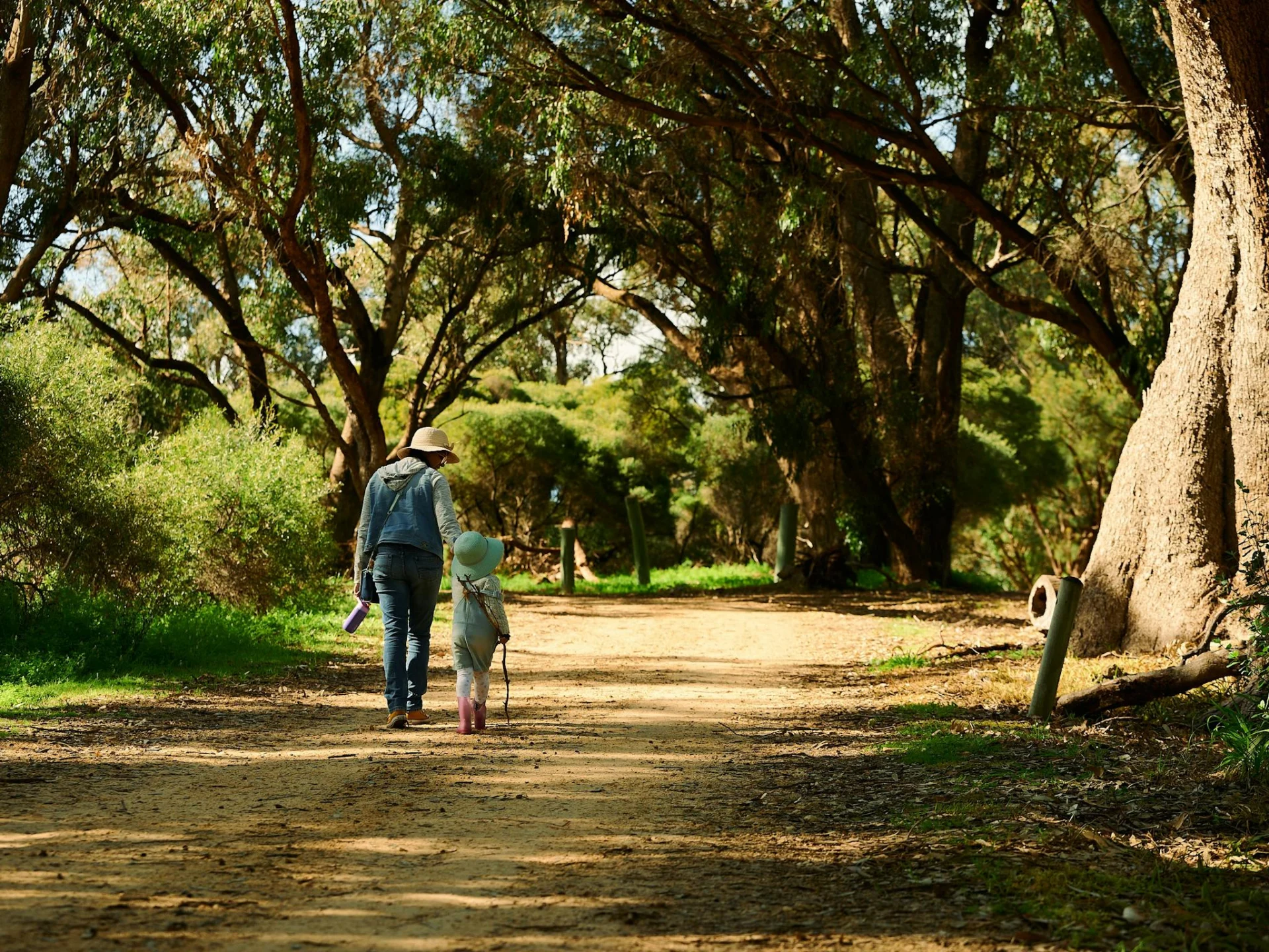 Woman and child walking through the Baldivis Childrens Forest
