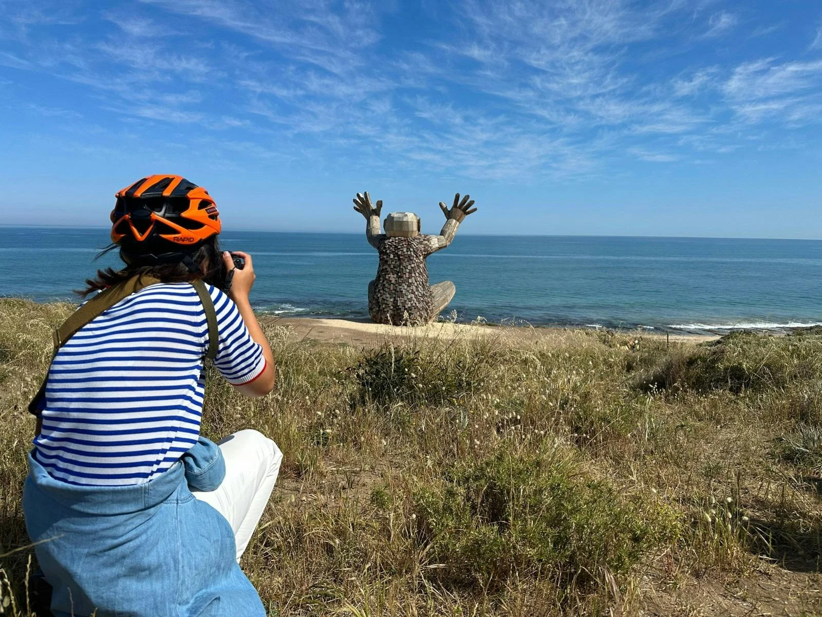 Guest photographing Santi Ikto, one of the Giants of Mandurah, overlooking the Indian Ocean