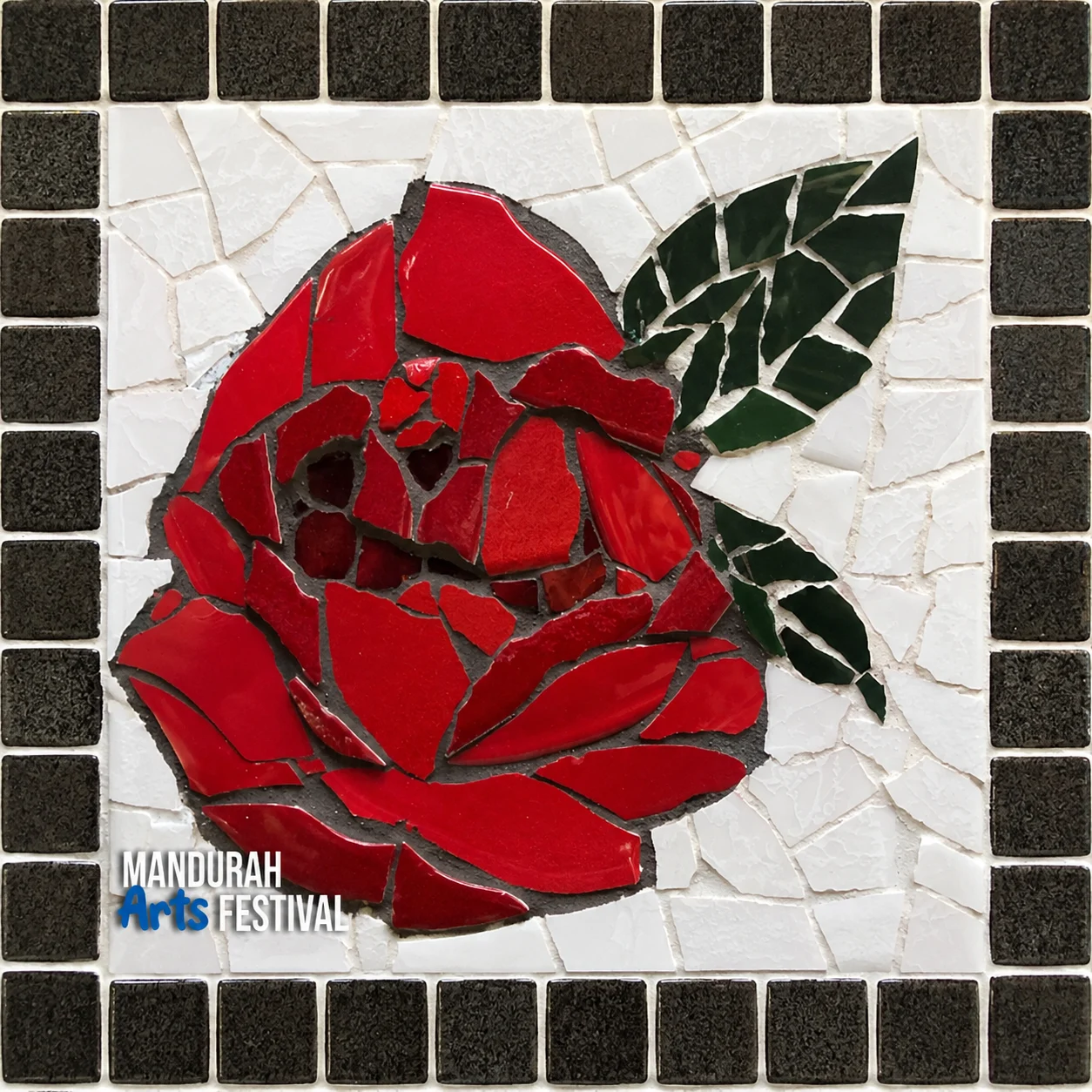 A mosaic of a red rose with green leaves on a white background, bordered by black tiles. The Mandurah Arts Festival logo appears in the bottom left corner.