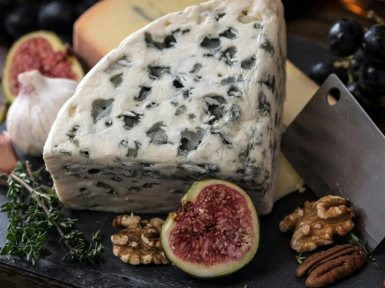 Artisan cheese platter served with accompaniments for a wine pairing experience.
