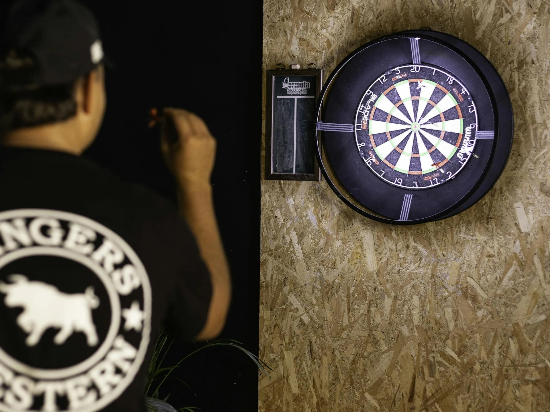 Man Playing Darts at X-Golf Rockingham