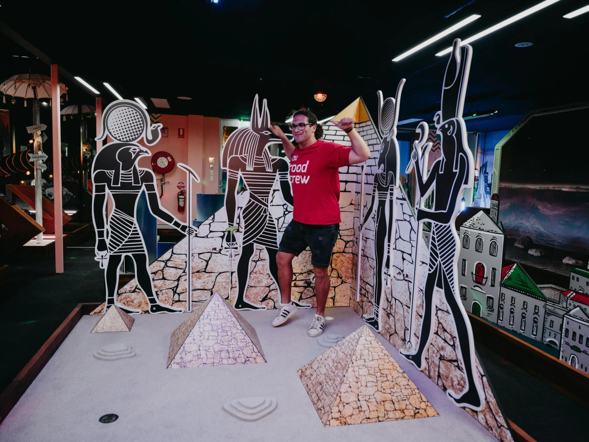 Man Enjoy Playing Mini Golf at Hey Caddy Venue