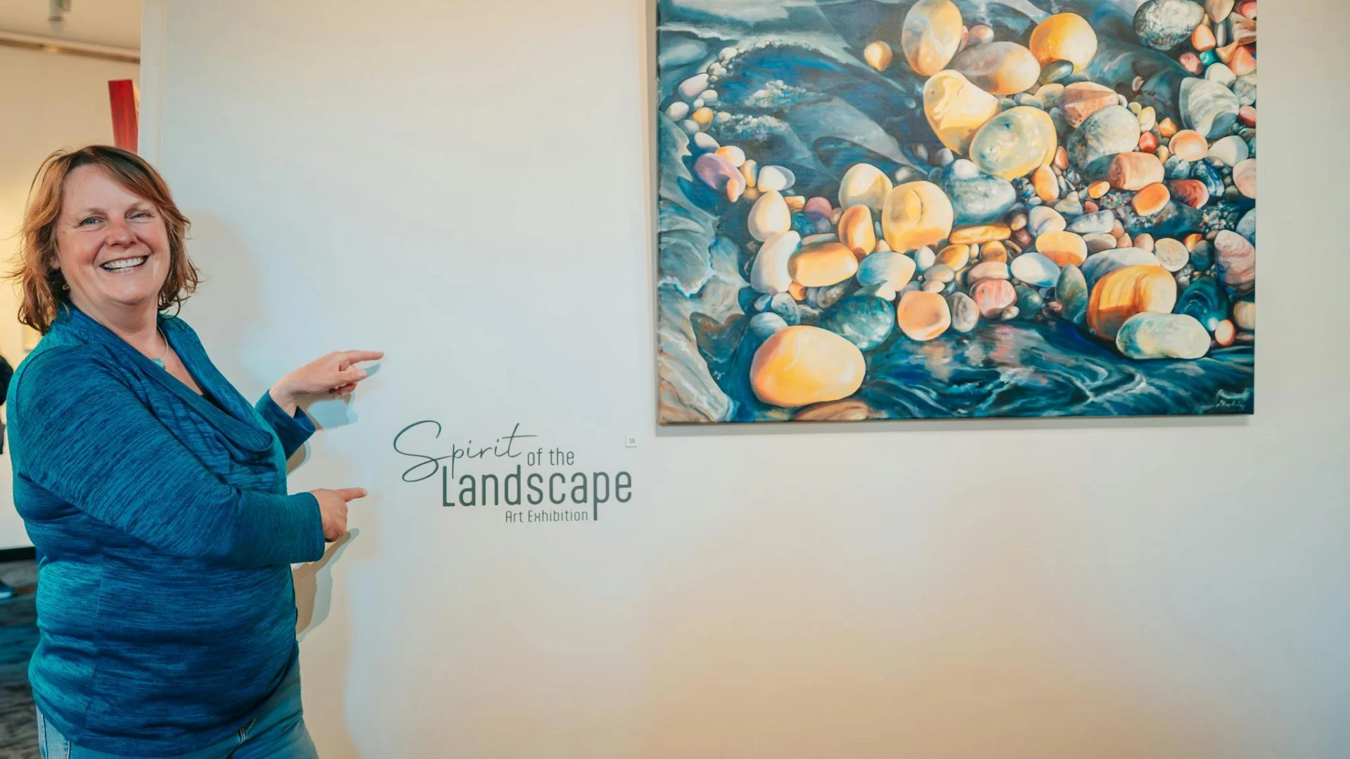 Artist Linda MacAulay(VIC) at Spirit of the Landscape Exhibition next to her painting