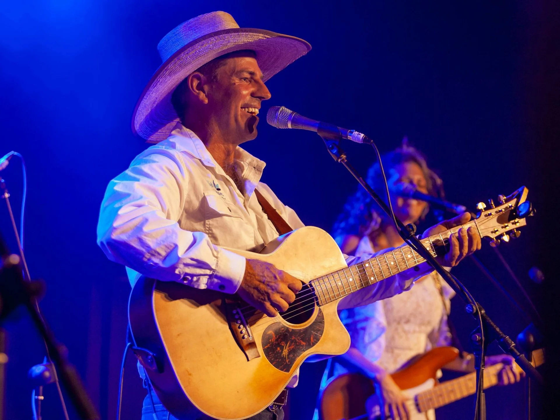 Tom Curtain performing on stage