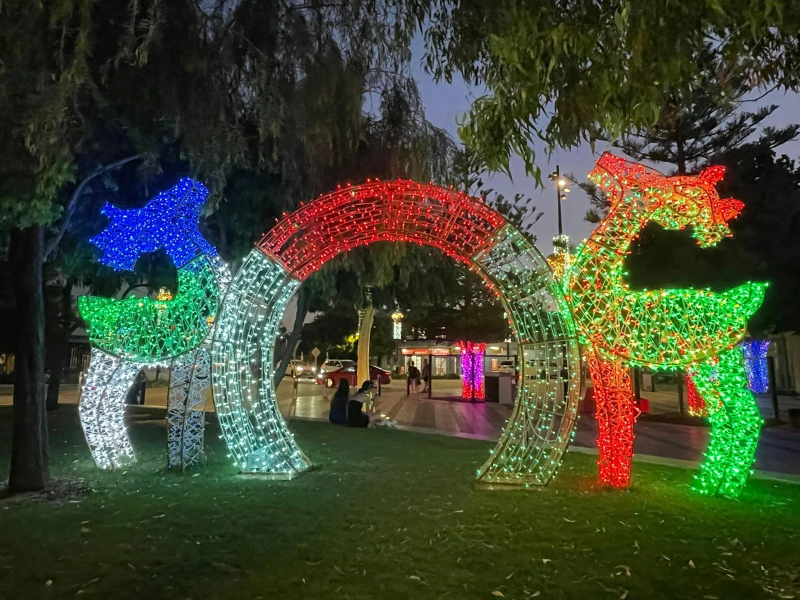 Two reindeer lights facing each other on either side of an arch