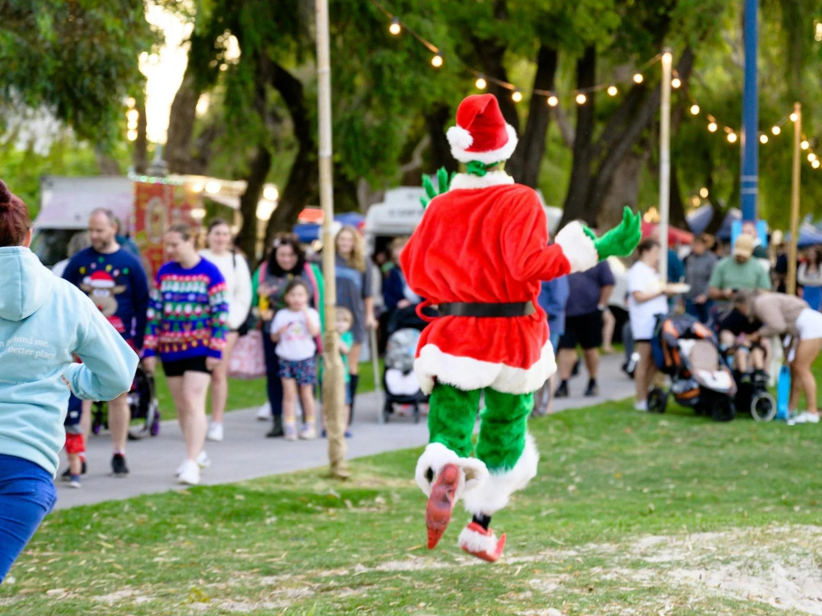 The grinch frolicking through the event