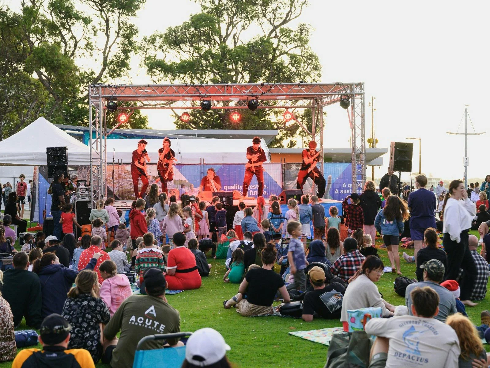 Christmas themed performers on a stage