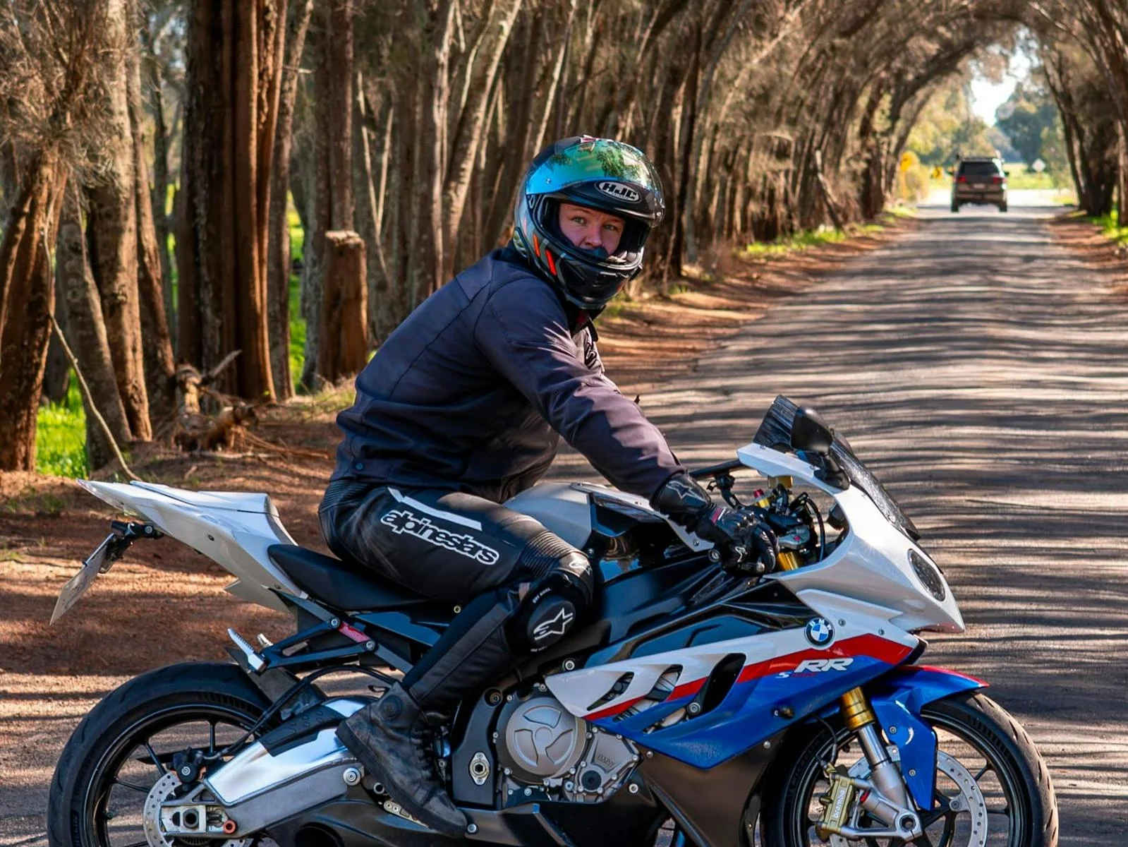 Sport bike with rider on scenic road